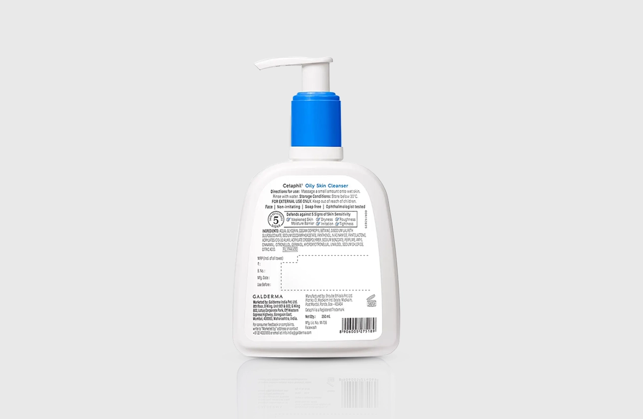 Back view of Cetaphil Oily Skin Cleanser bottle with a blue pump, showing usage directions, ingredients, and product details.