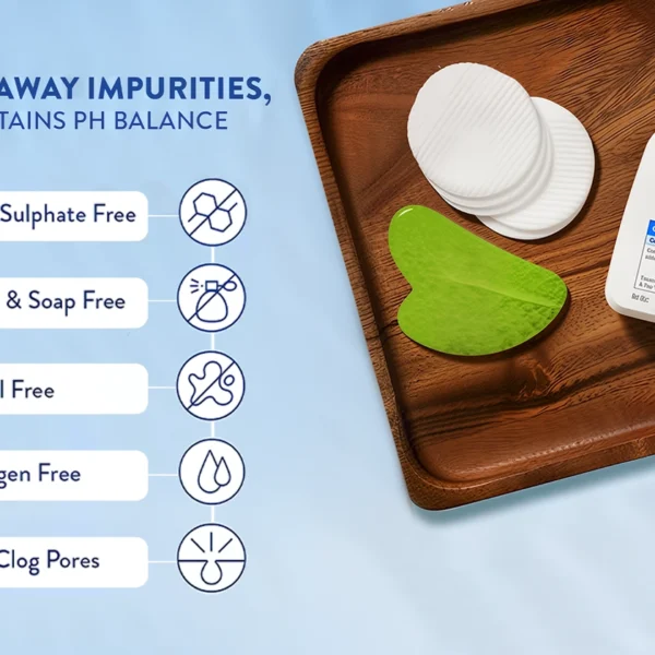 Cetaphil Oily Skin Cleanser bottle on a wooden tray with pads, highlighting its paraben-free, sulfate-free, fragrance-free, and non-comedogenic features.