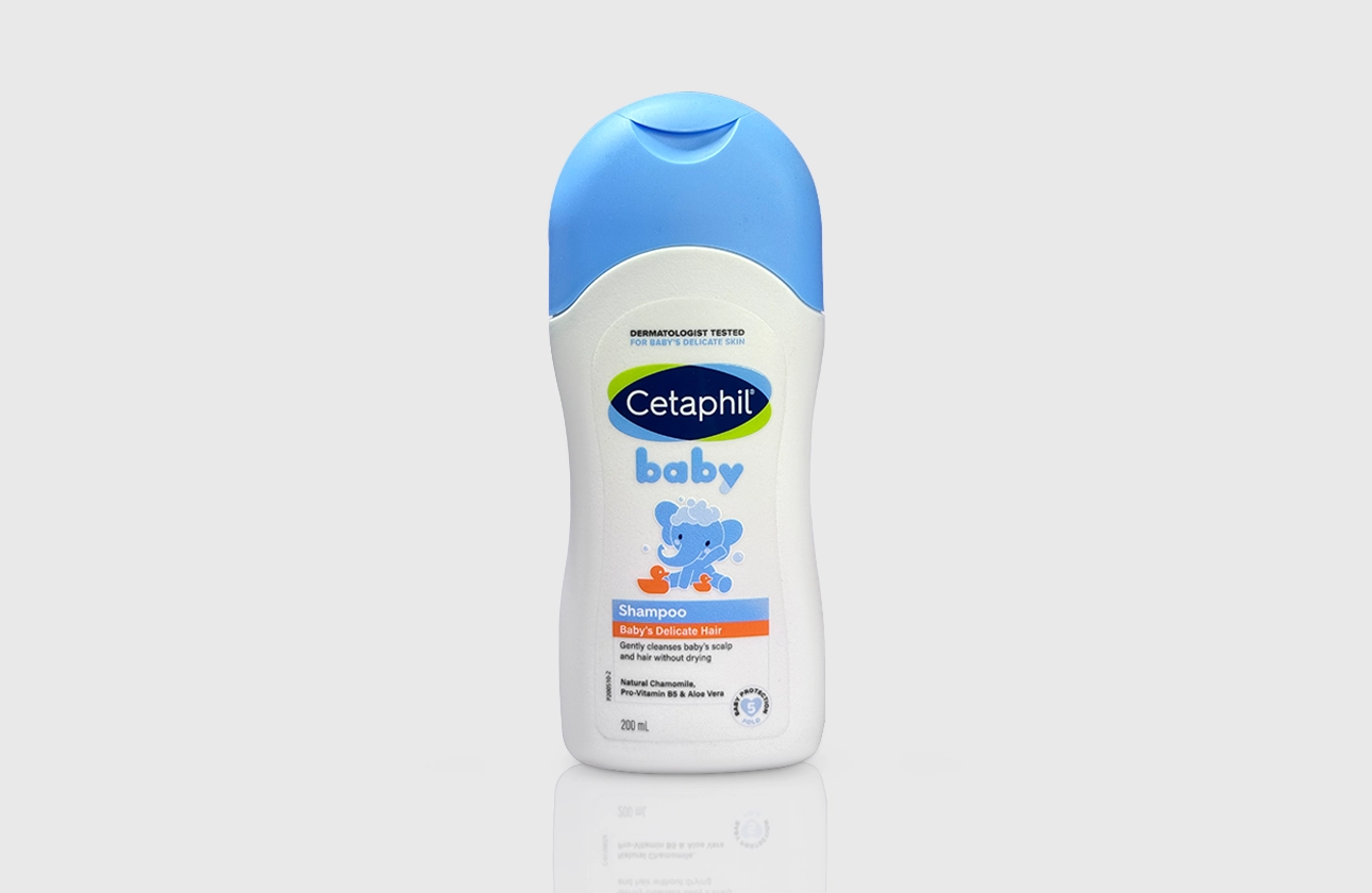 Cetaphil Baby shampoo in a white bottle with light blue accents and a child illustration.